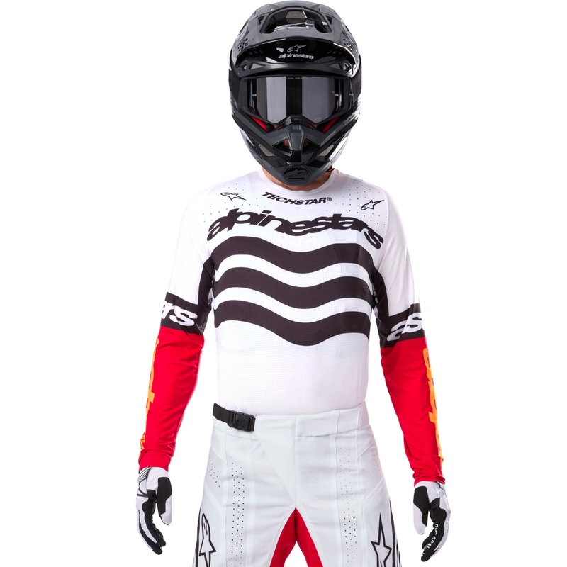 Camiseta de motocross Alpinestars Techstar edición limitada en negro intenso, blanco, rojo fluorescente y naranja.