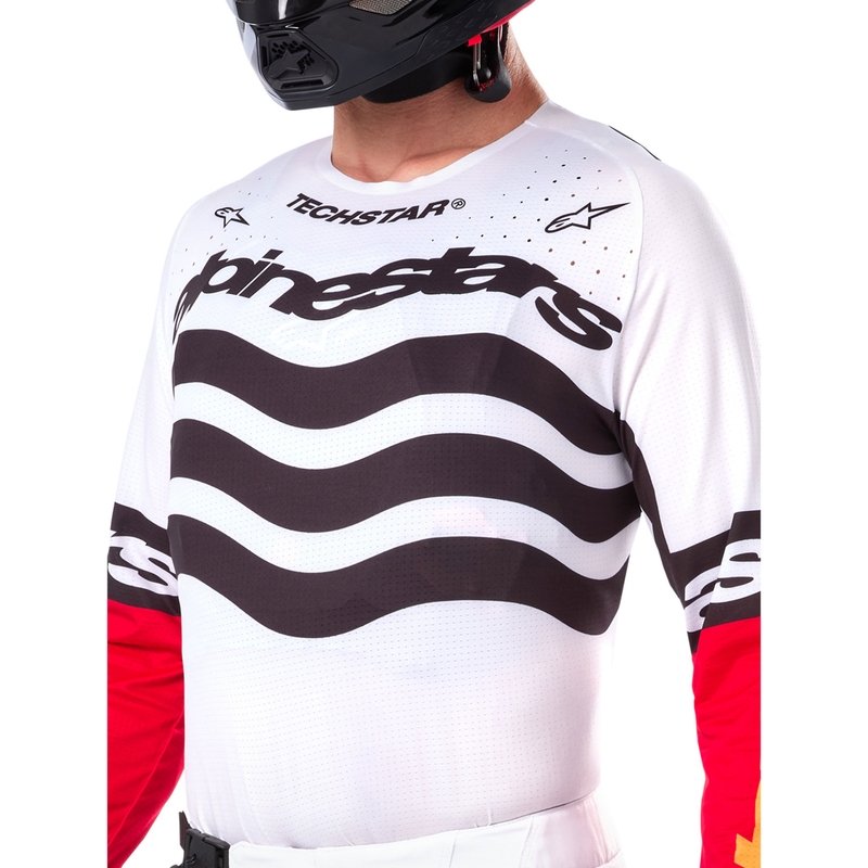 Camiseta de motocross Alpinestars Techstar edición limitada en negro intenso, blanco, rojo fluorescente y naranja.