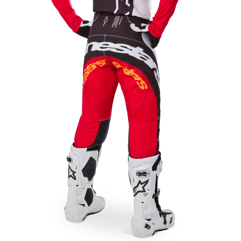 Pantalones de motocross Alpinestars Techstar edición limitada en negro intenso, blanco, rojo fluorescente y naranja.