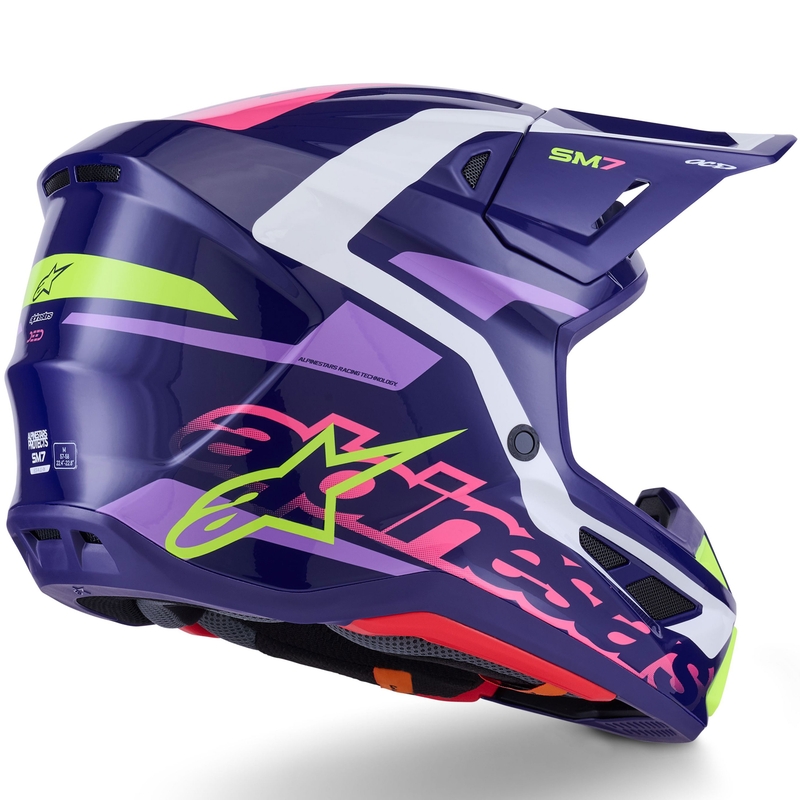 Casco de motocross Alpinestars SM7 Deed en morado, rosa, blanco y amarillo fluorescente.