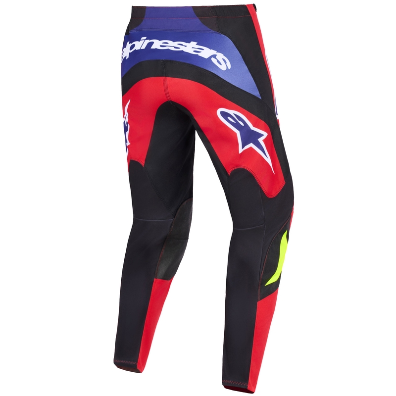 Pantalones de motocross Alpinestars Fluid Grid en rojo, negro, morado y amarillo fluorescente.