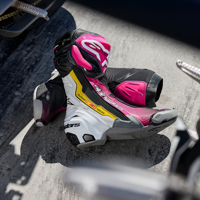 Botas de moto Alpinestars Supertech R negras, blancas, rosas y amarillas