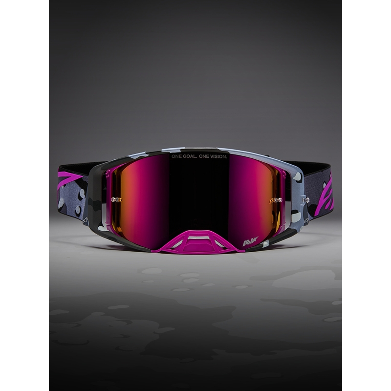 Gafas de motocross Alpinestars Supertech Lone con estampado de camuflaje morado y cristal de plexiglás rosa espejado.