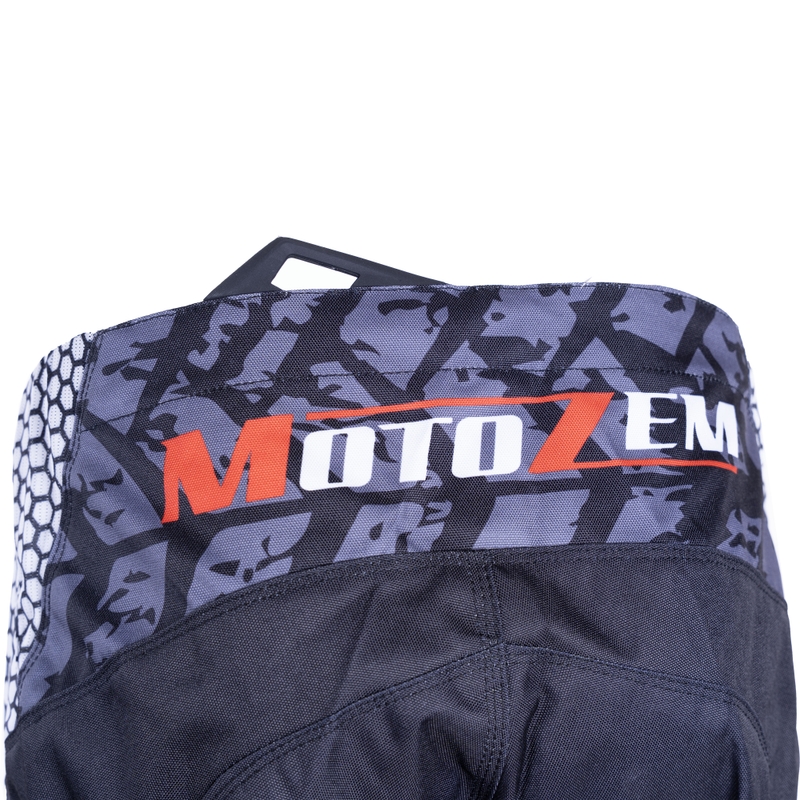 Pantalones de motocross MotoZem Ground MX en negro, blanco y rojo.